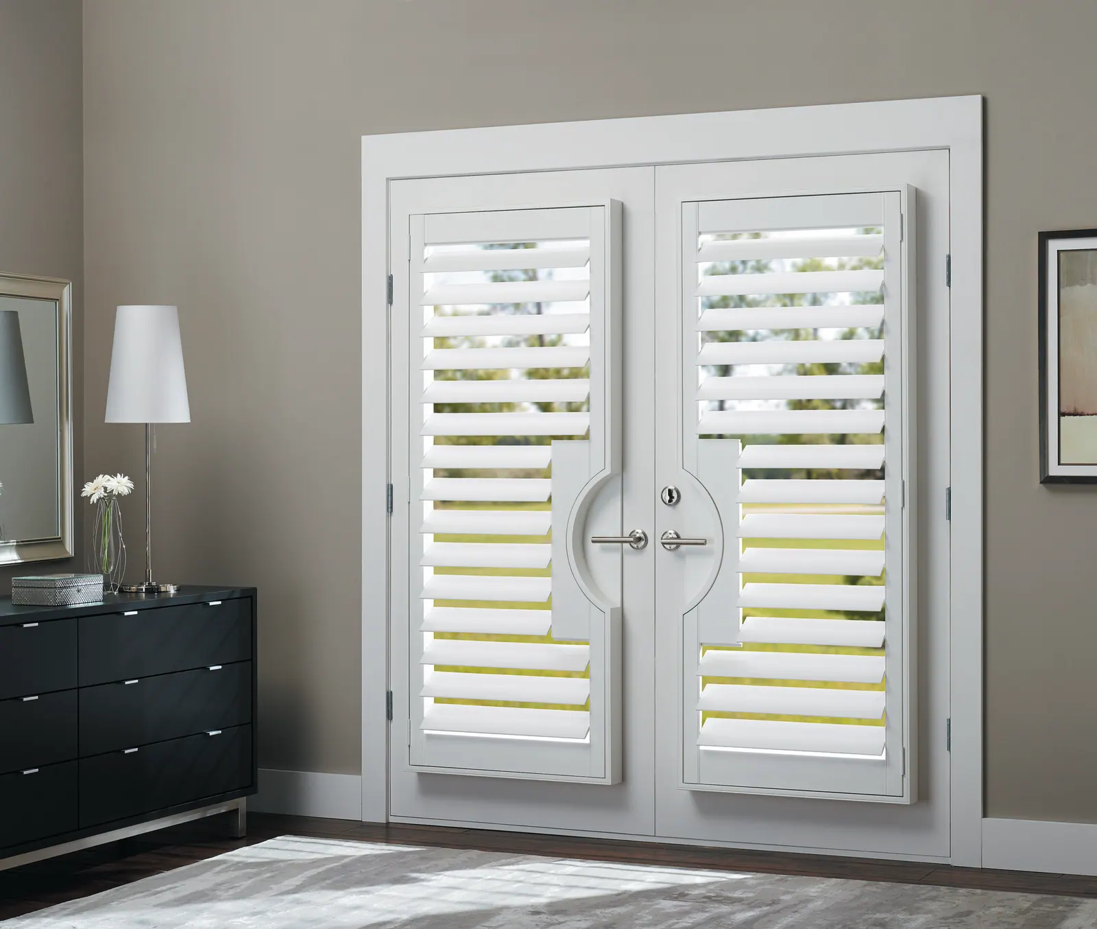 Plantation shutters mounted on French doors in a bedroom