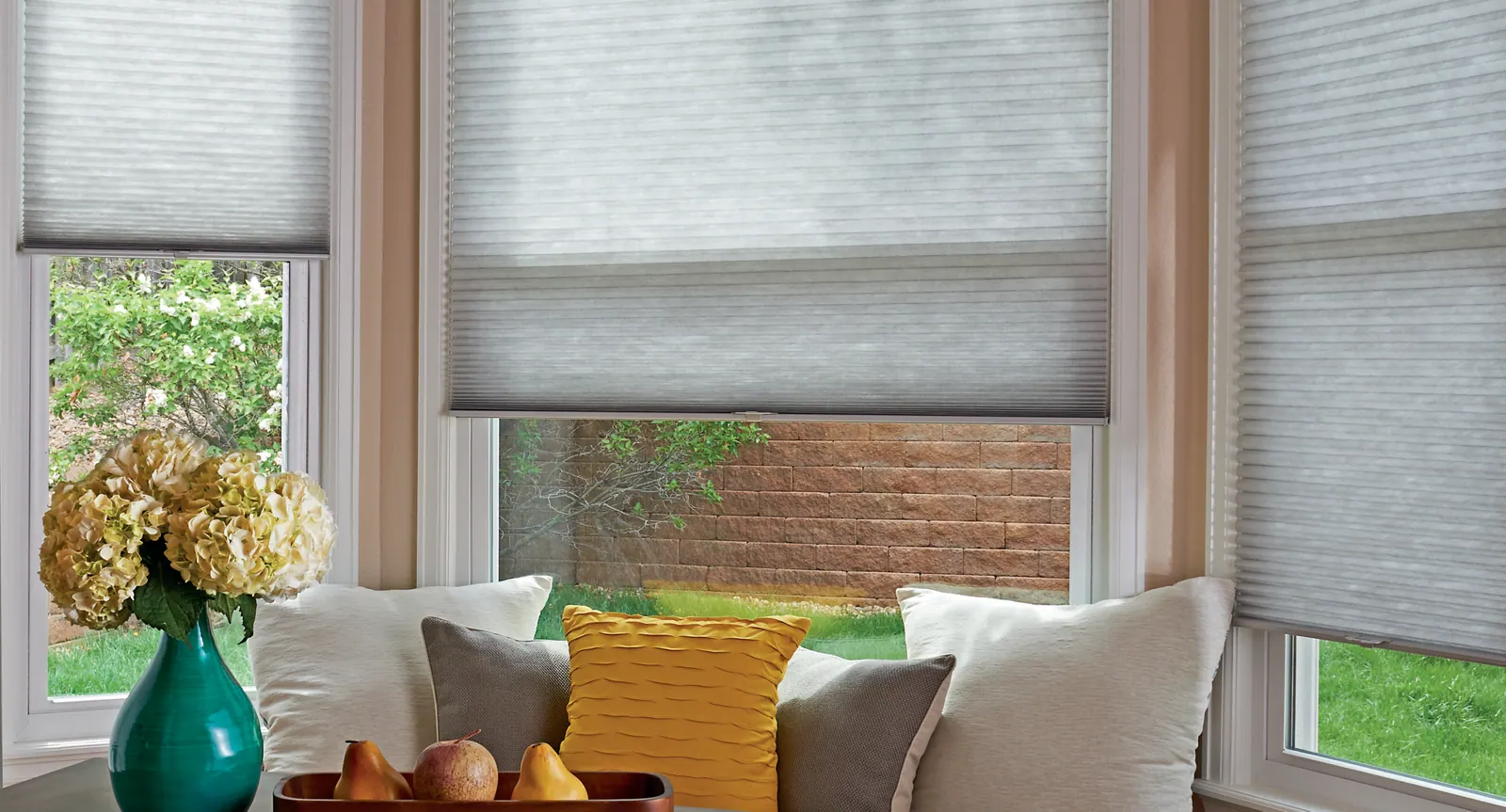 Close view of honeycomb shade cells in a dining room