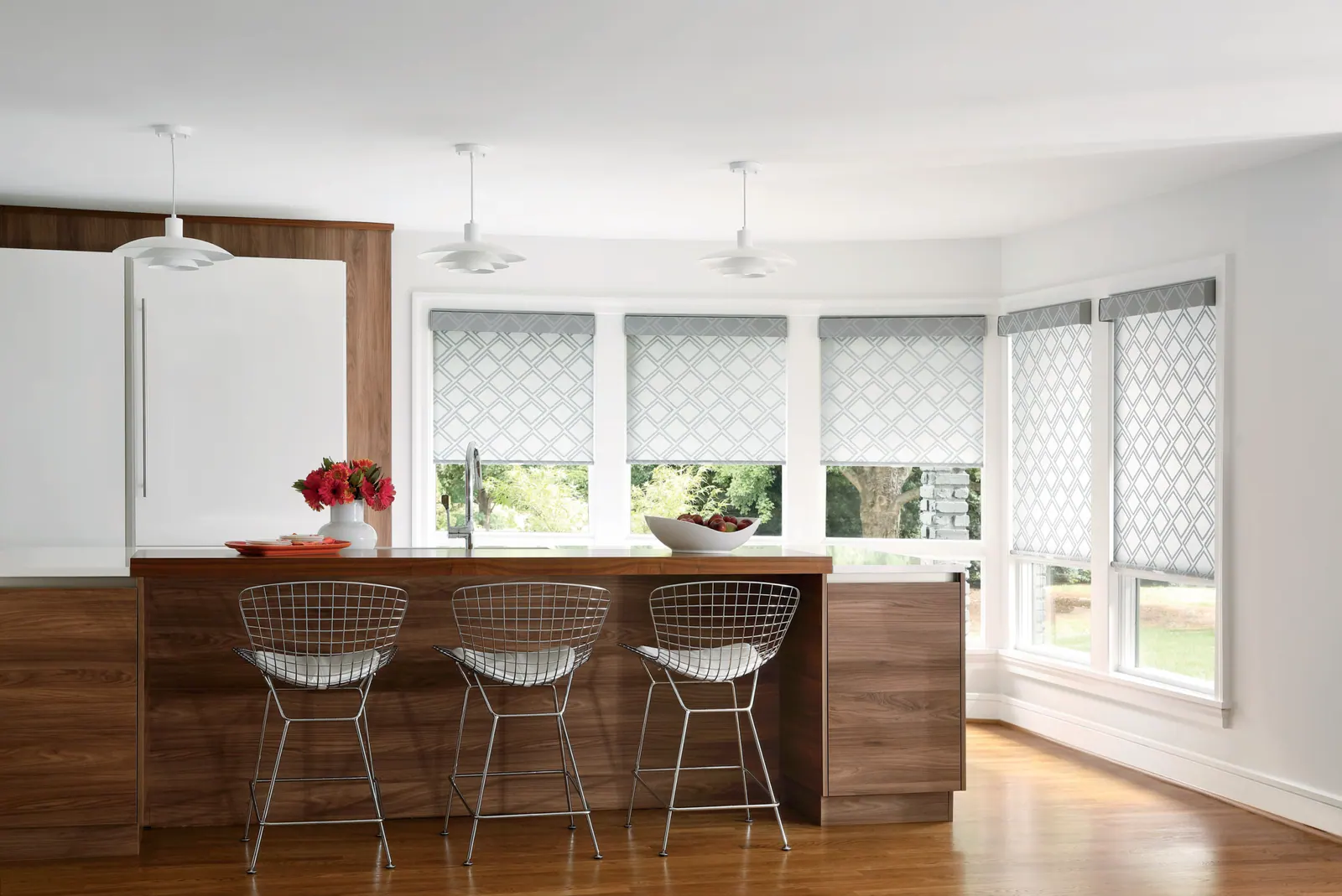 Roller shades over a kitchen window in a Colorado home
