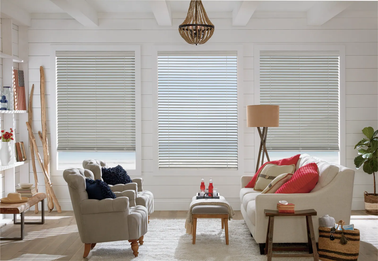 Wood blinds across three living room windows