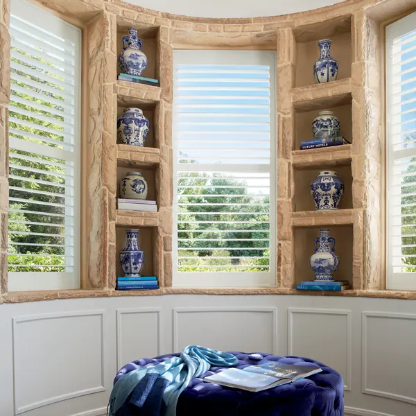 Shutters with louvers open in a home study