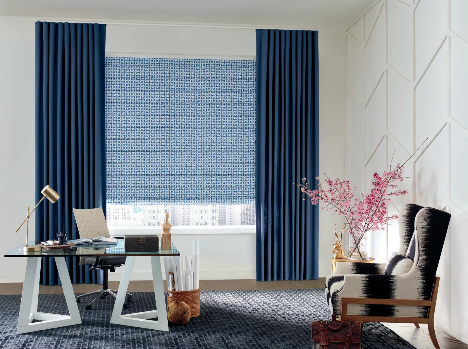 Custom draperies in a geometric pattern framing an office window