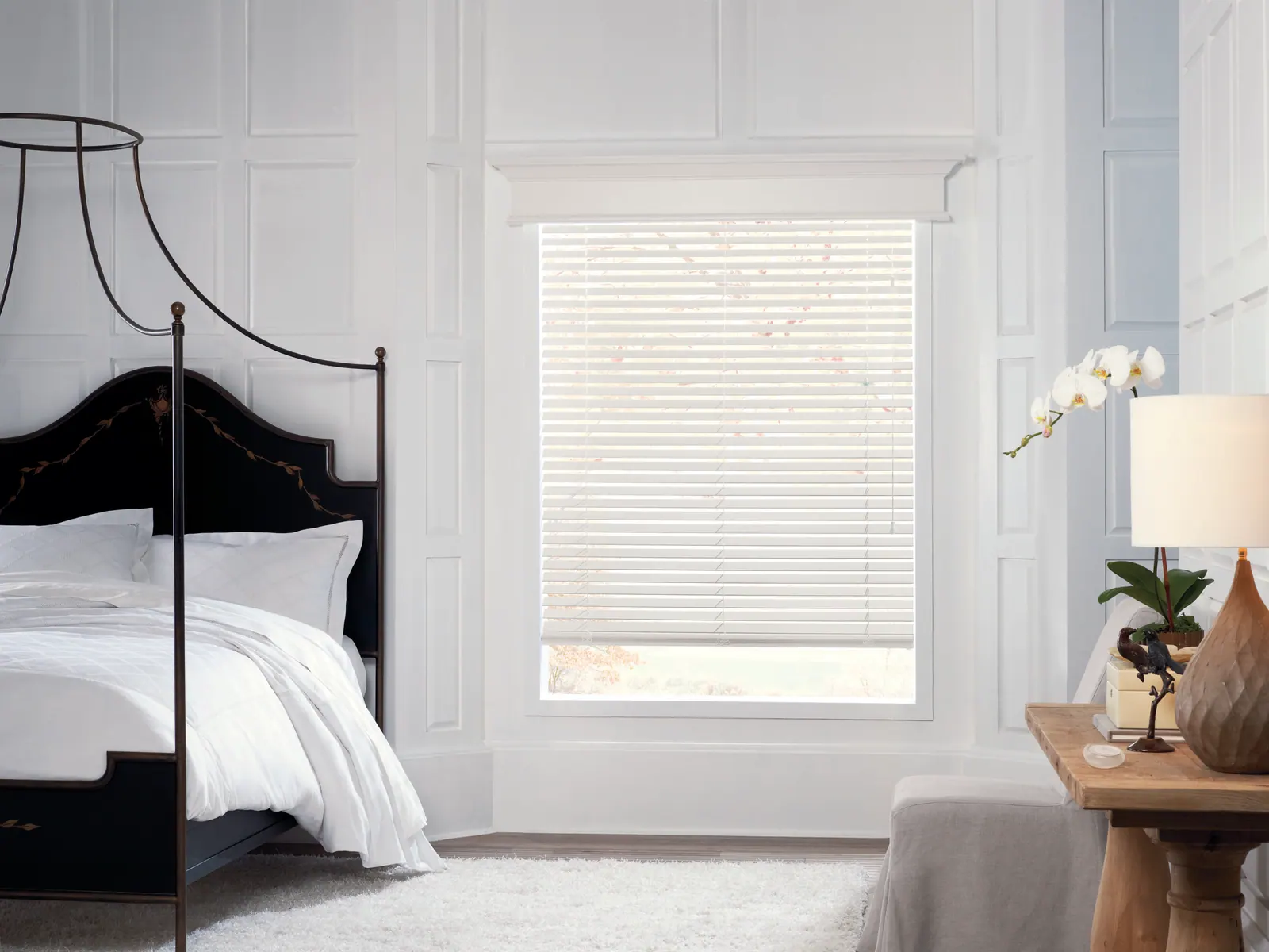White basswood blinds in a bedroom