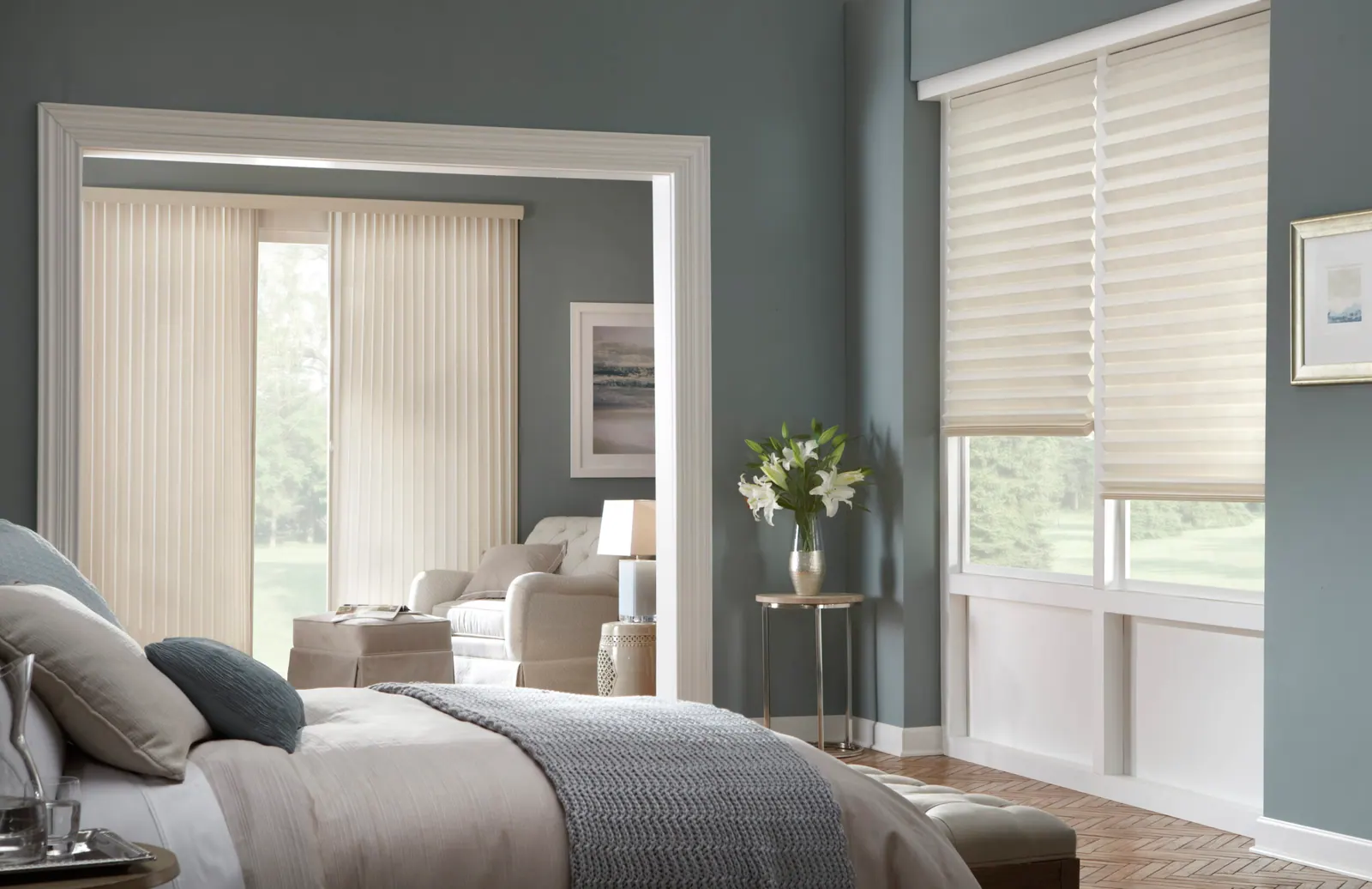 Vertical honeycomb shades covering a bedroom patio door